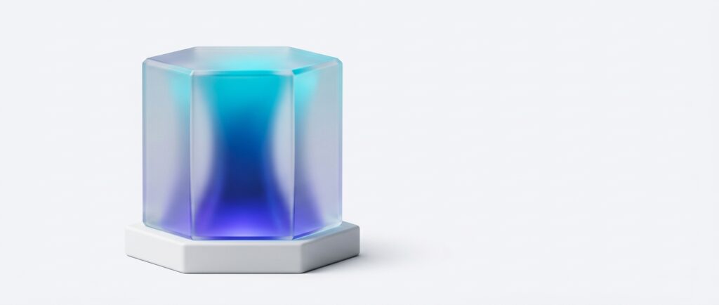 Frosted glass hexagon resting on a white ceramic hexagonal base, with indigo to cyan light glowing through the glass from below, on a light grey background.